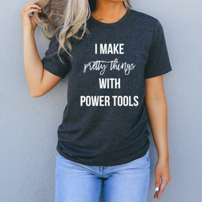 woman wearing woodworking things - I make pretty things with power tools