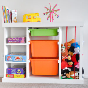 DIY toy organizer with orange bins and toys