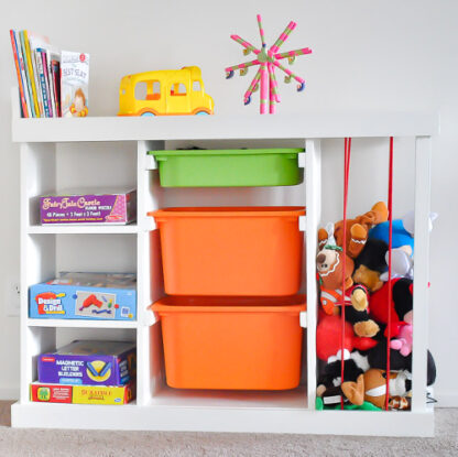DIY toy organizer with orange bins and toys
